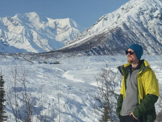 Eric poses in front of the Root Glacier, Alaska