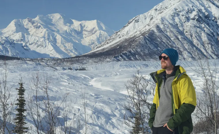 Eric poses in front of the Root Glacier, Alaska